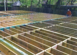 Treated Glulam Beams in an outdoor setting with trees
