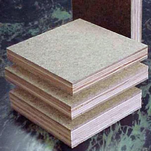 Square pieces of Tempered Hardboard laid on a surface
