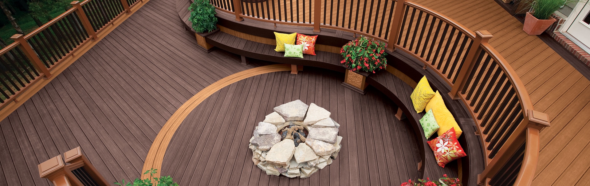 Outdoor patio wood decking and fencing with a firepit from Weekes Forest Products materials